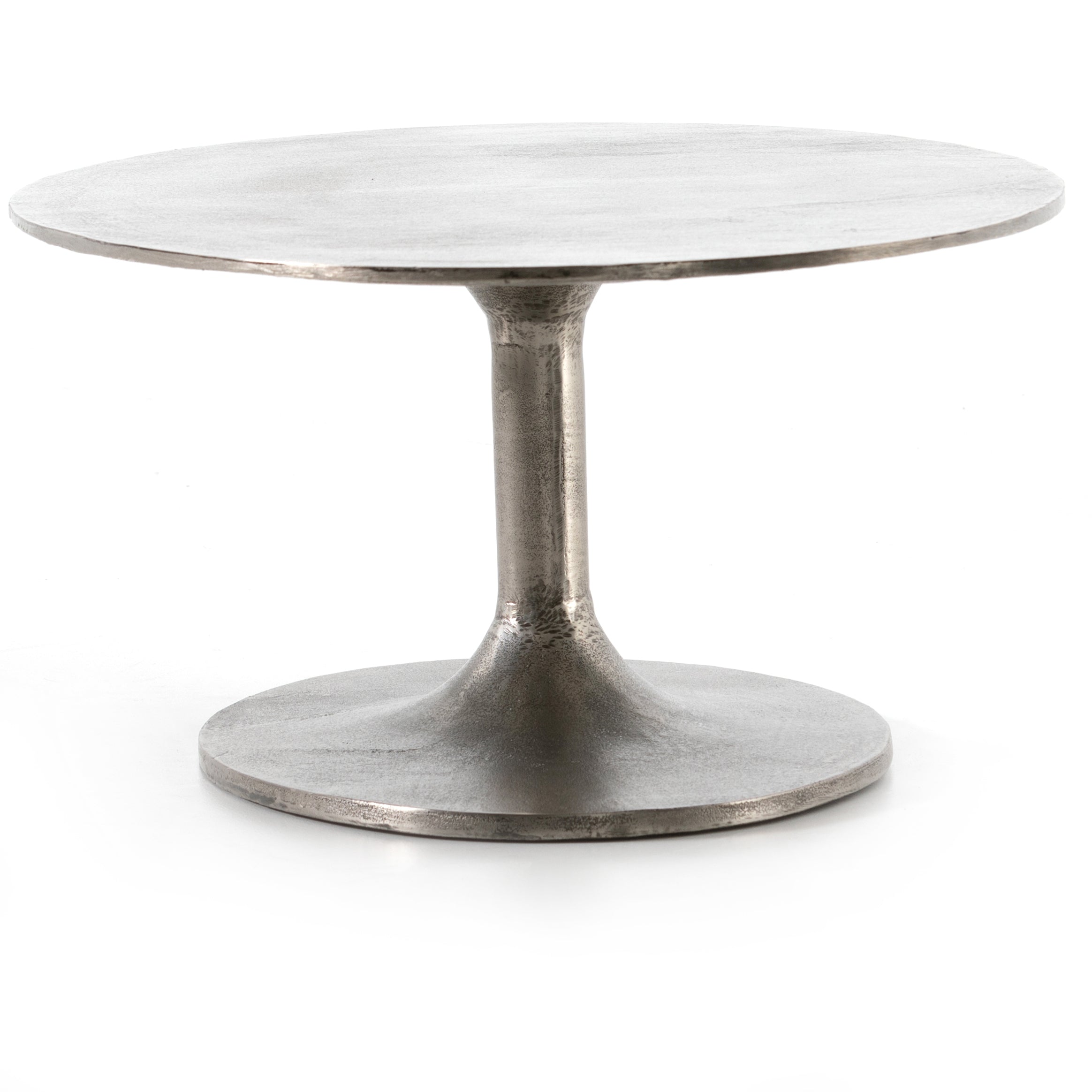We love the oval shape of this Simone Coffee Table - Antique Nickel. The textural cast aluminum makes for a beautifully modern coffee table, with alluring highs and lows played up by a raw nickel finish. Great indoors or out; cover or store indoors during inclement weather and when not in use.  Overall Dimensions: 54.75"w x 29.25"d x 16.50"h