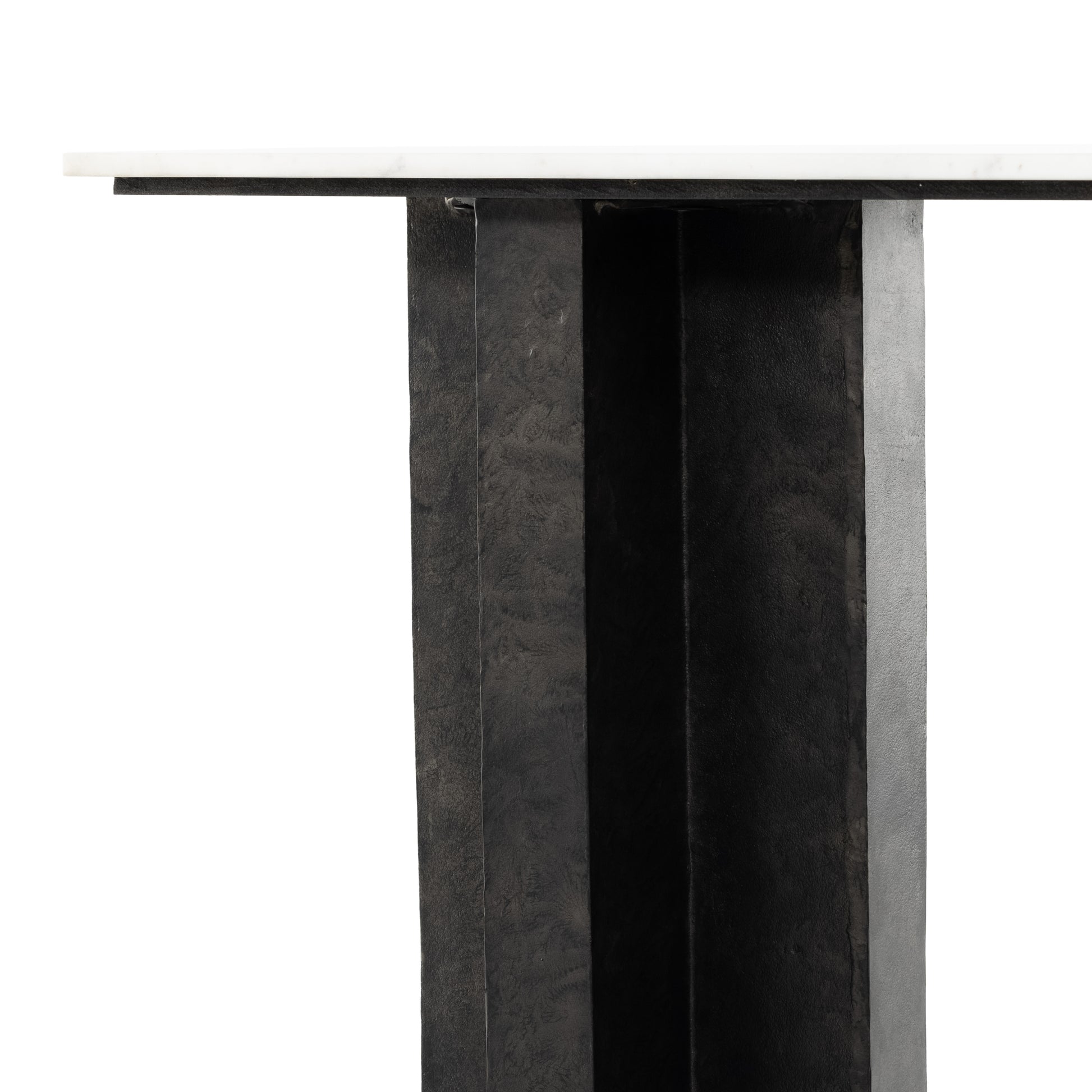 Finished in a raw black, uniquely angular cast aluminum legs, this Terrell Console Table - Raw Black showcases a rectangular tabletop of solid marble in a clean, polished white. We'd love to see this in an entryway or behind a sofa.   Overall Dimensions: 51.00"w x 17.00"d x 31.25"h