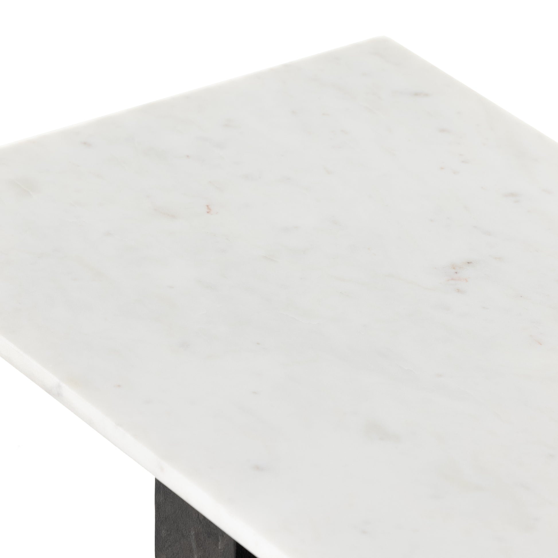 Finished in a raw black, uniquely angular cast aluminum legs, this Terrell Console Table - Raw Black showcases a rectangular tabletop of solid marble in a clean, polished white. We'd love to see this in an entryway or behind a sofa.   Overall Dimensions: 51.00"w x 17.00"d x 31.25"h
