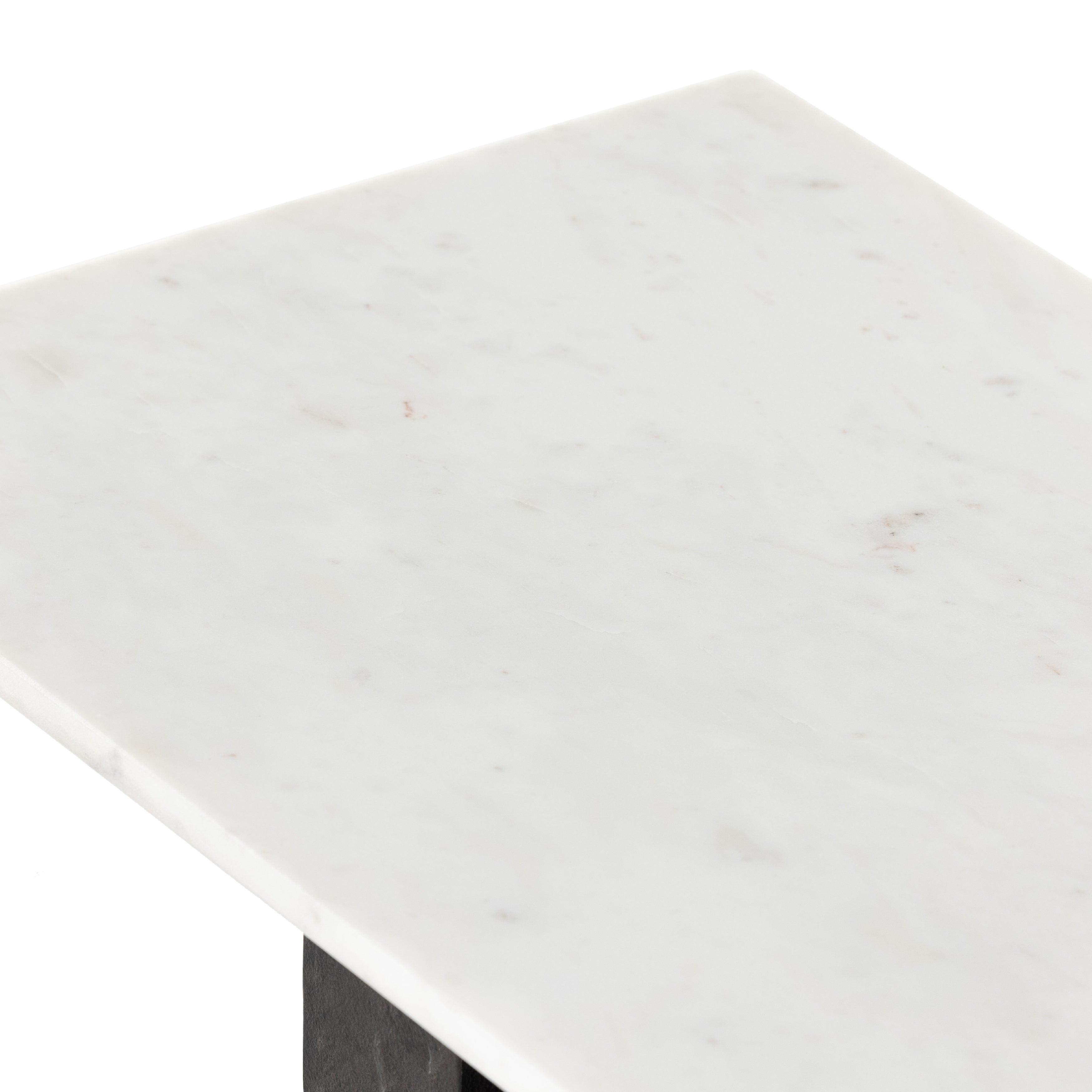 Finished in a raw black, uniquely angular cast aluminum legs, this Terrell Console Table - Raw Black showcases a rectangular tabletop of solid marble in a clean, polished white. We'd love to see this in an entryway or behind a sofa.   Overall Dimensions: 51.00"w x 17.00"d x 31.25"h