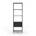 This stylishTrey Bookshelf - Black Wash Poplar offers ample storage space by way of open shelving and dual drawers. Metal-secured pulls of toffee top-grain leather add a textural element of surprise to any office, bedroom, or other space.   Overall Dimensions: 24.00"w x 18.00"d x 78.25"h