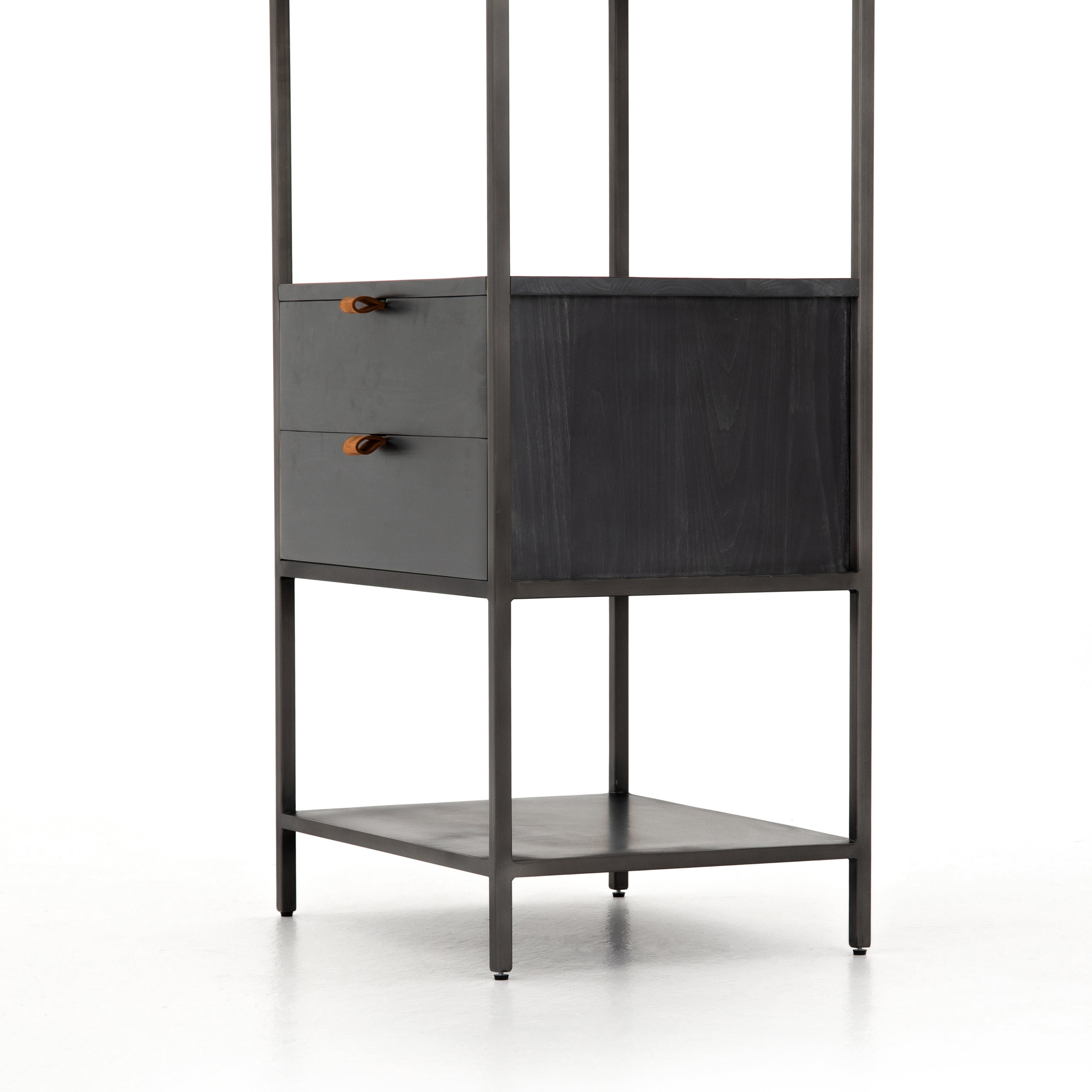 This stylishTrey Bookshelf - Black Wash Poplar offers ample storage space by way of open shelving and dual drawers. Metal-secured pulls of toffee top-grain leather add a textural element of surprise to any office, bedroom, or other space.   Overall Dimensions: 24.00"w x 18.00"d x 78.25"h