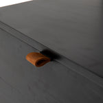 This stylish Trey Bookshelf - Black Wash Poplar offers ample storage space by way of open shelving and dual drawers. Metal-secured pulls of toffee top-grain leather add a textural element of surprise to any office, bedroom, or other space.   Overall Dimensions: 24.00"w x 18.00"d x 78.25"h