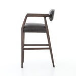 Featuring Tyler Chaps Ebony Counter Stool by Four Hands at Amethyst Home. The Tyler Counter Stool in Chaps Ebony makes counter seating stylish with an angular, dark and smoky birch frame, a deep seat, and a striking, low-slung back. The stool is comfortable for long dinners and conversations with a covered black, top-grain leather seat and back.
Counter S.  Amethyst Home provides interior design, new home construction design consulting, vintage area rugs, and lighting in the Scottsdale metro area.