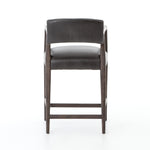 Featuring Tyler Chaps Ebony Counter Stool by Four Hands at Amethyst Home. The Tyler Counter Stool in Chaps Ebony makes counter seating stylish with an angular, dark and smoky birch frame, a deep seat, and a striking, low-slung back. The stool is comfortable for long dinners and conversations with a covered black, top-grain leather seat and back.
Counte.  Amethyst Home provides interior design, new home construction design consulting, vintage area rugs, and lighting in the Winter Garden metro area.