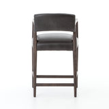 Featuring Tyler Chaps Ebony Counter Stool by Four Hands at Amethyst Home. The Tyler Counter Stool in Chaps Ebony makes counter seating stylish with an angular, dark and smoky birch frame, a deep seat, and a striking, low-slung back. The stool is comfortable for long dinners and conversations with a covered black, top-grain leather seat and back.
Counte.  Amethyst Home provides interior design, new home construction design consulting, vintage area rugs, and lighting in the Winter Garden metro area.