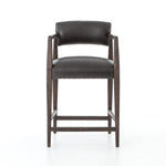 Featuring Tyler Chaps Ebony Counter Stool by Four Hands at Amethyst Home. The Tyler Counter Stool in Chaps Ebony makes counter seating stylish with an angular, dark and smoky birch frame, a deep seat, and a striking, low-slung back. The stool is comfortable for long dinners and conversations with a covered black, top-grain leather seat and back.
Counter StoolS.  Amethyst Home provides interior design, new home construction design consulting, vintage area rugs, and lighting in the Tampa metro area.