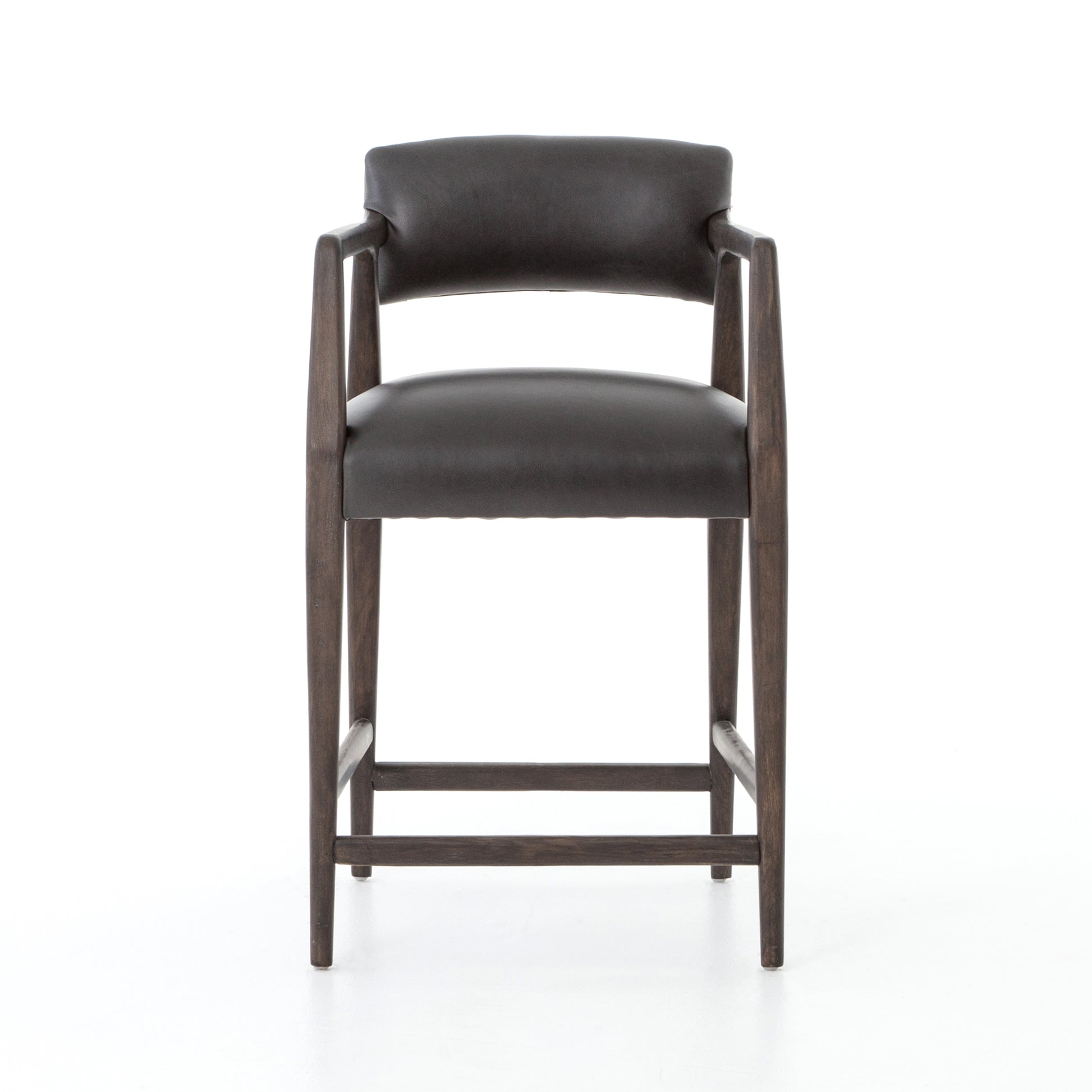 The Tyler Bar + Counter Stool - Ebony makes counter seating stylish with an angular, dark and smoky birch frame, a deep seat, and a striking, low-slung back. The stool is comfortable for long dinners and conversations with a covered black, top-grain leather seat and back.