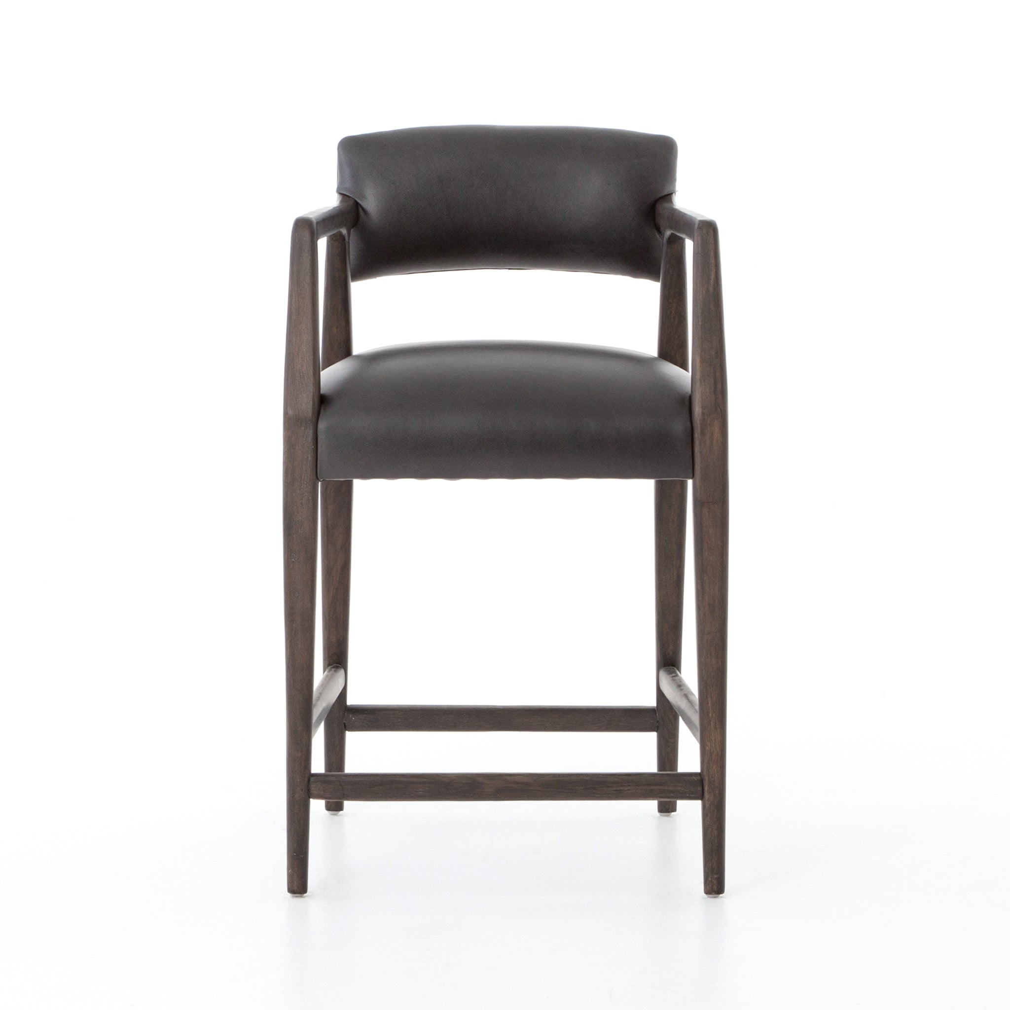 The Tyler Bar + Counter Stool - Ebony makes counter seating stylish with an angular, dark and smoky birch frame, a deep seat, and a striking, low-slung back. The stool is comfortable for long dinners and conversations with a covered black, top-grain leather seat and back.