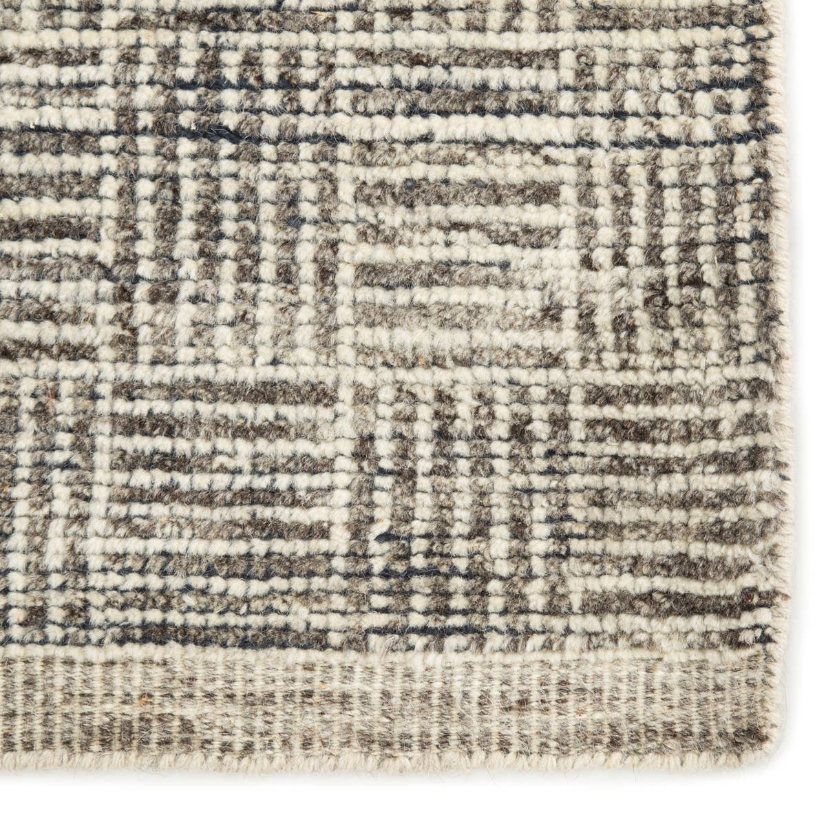 The Rize Mugler Area Rug offers intricate and delicately designed global patterns to the modern home. A thatched square motif creates an eye-catching geometric design on the artistically distressed Mugler area rug. In an earthy ivory and black colorway, this durable hand-knotted wool accent blends a timeless craft with contemporary charm.  Hand Knotted 100% Wool RIZ05