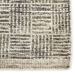 The Rize Mugler Area Rug offers intricate and delicately designed global patterns to the modern home. A thatched square motif creates an eye-catching geometric design on the artistically distressed Mugler area rug. In an earthy ivory and black colorway, this durable hand-knotted wool accent blends a timeless craft with contemporary charm.  Hand Knotted 100% Wool RIZ05