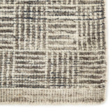 The Rize Mugler Area Rug offers intricate and delicately designed global patterns to the modern home. A thatched square motif creates an eye-catching geometric design on the artistically distressed Mugler area rug. In an earthy ivory and black colorway, this durable hand-knotted wool accent blends a timeless craft with contemporary charm.  Hand Knotted 100% Wool RIZ05