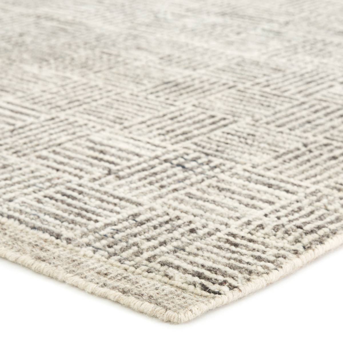 The Rize Mugler Area Rug offers intricate and delicately designed global patterns to the modern home. A thatched square motif creates an eye-catching geometric design on the artistically distressed Mugler area rug. In an earthy ivory and black colorway, this durable hand-knotted wool accent blends a timeless craft with contemporary charm.  Hand Knotted 100% Wool RIZ05