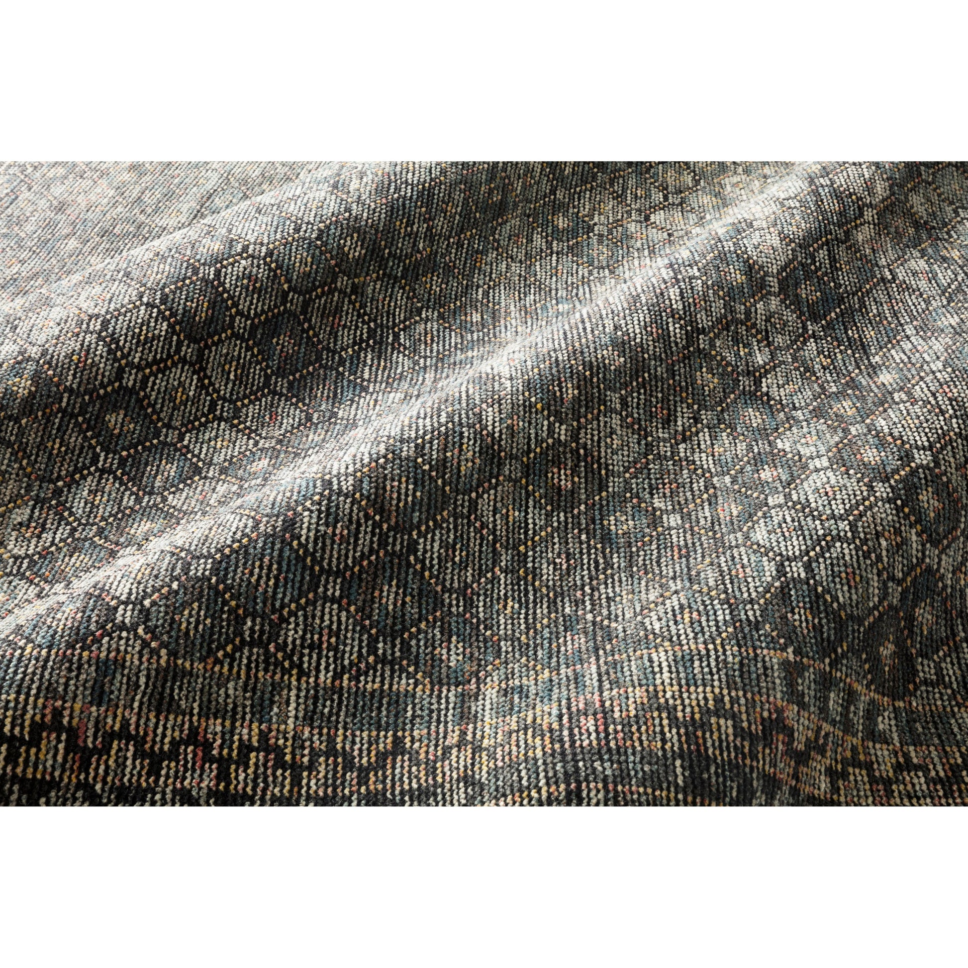 Hand-knotted in India of 100% wool, the Amara Ink/Turquoise Rug creates a casual yet refined vibe with high-end appeal. Showcase in your bedroom, living room, entryway, or other high-traffic area of your home.   Hand Knotted 100% Wool AMM-01 Ink/Turquoise