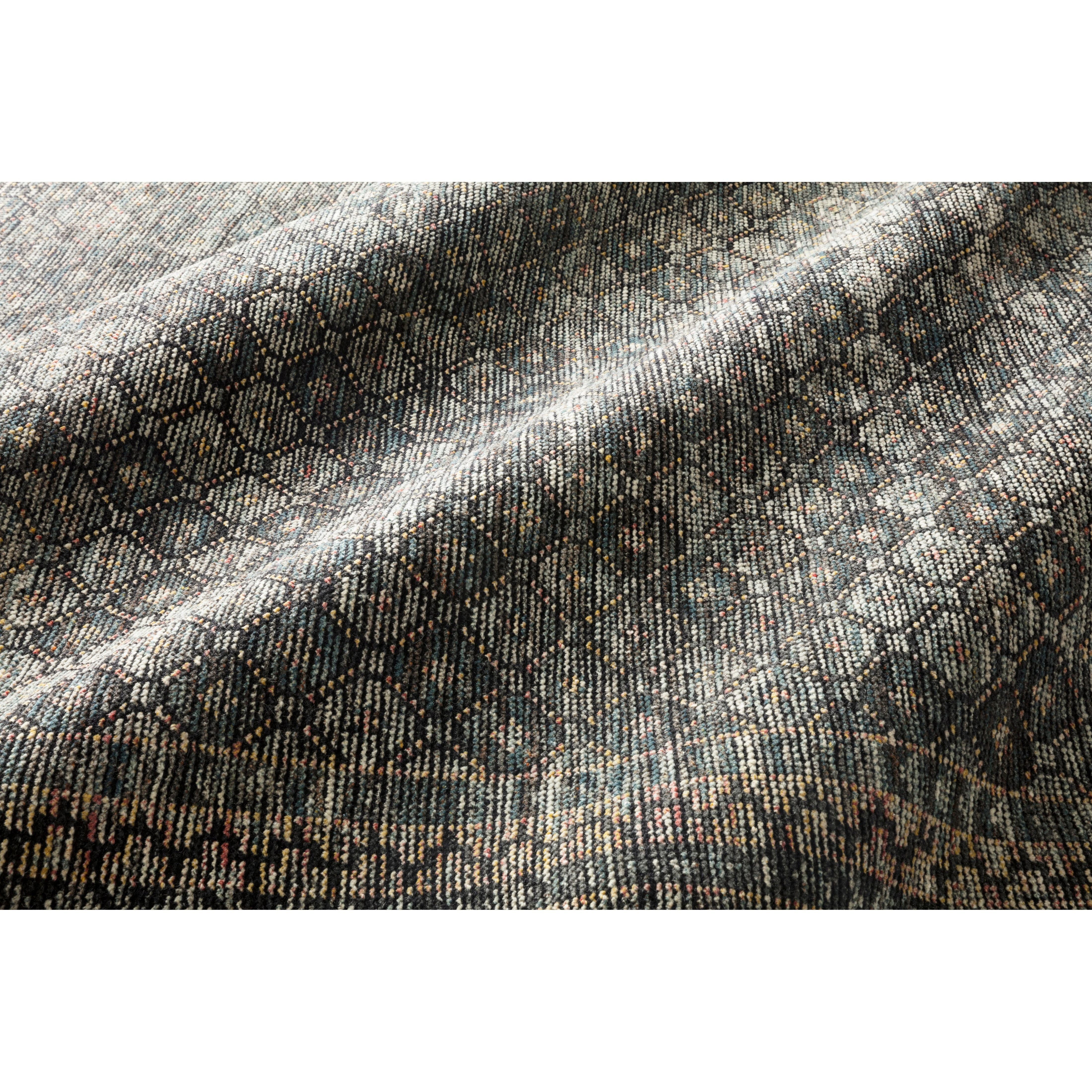 Hand-knotted in India of 100% wool, the Amara Ink/Turquoise Rug creates a casual yet refined vibe with high-end appeal. Showcase in your bedroom, living room, entryway, or other high-traffic area of your home.   Hand Knotted 100% Wool AMM-01 Ink/Turquoise