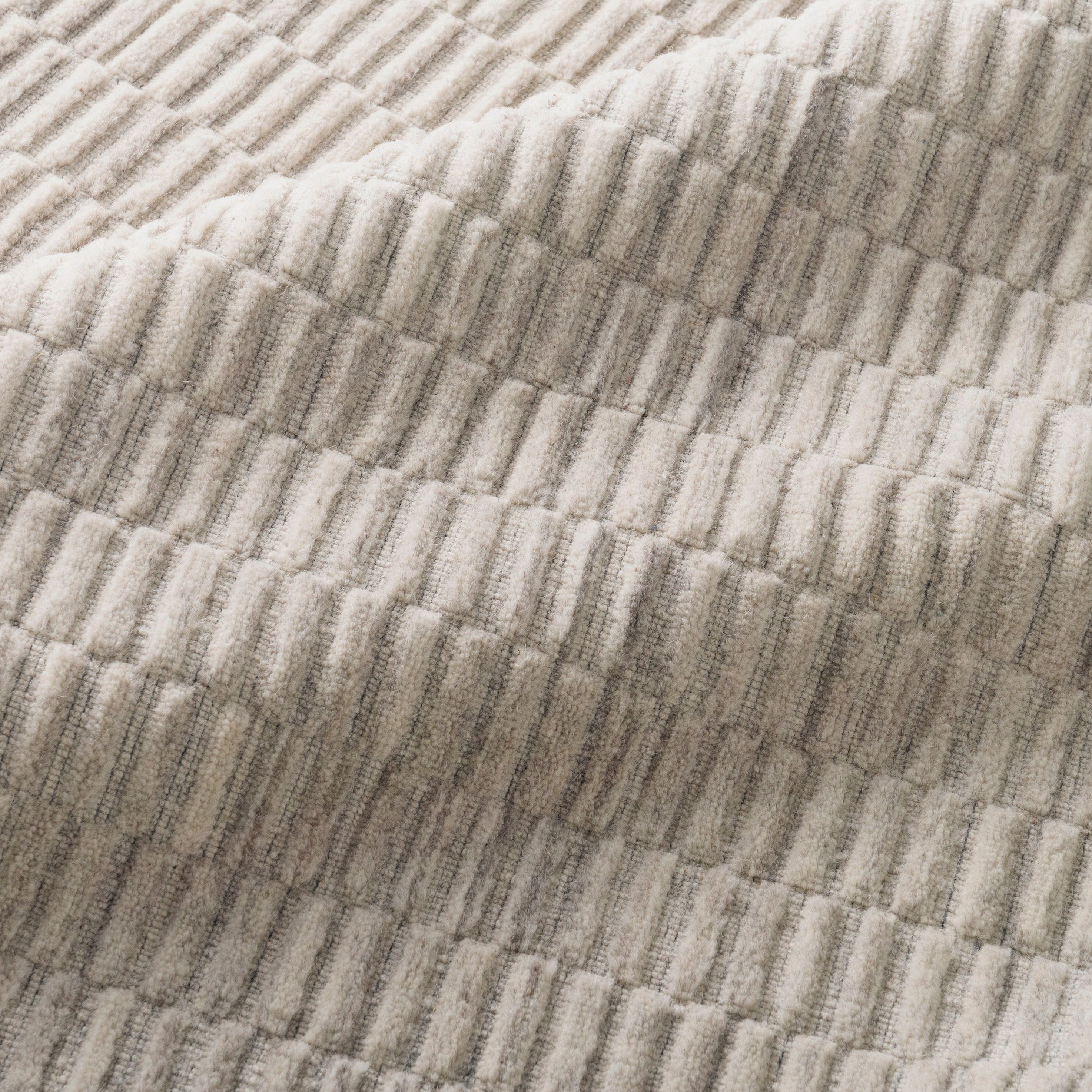 Natural beauty is expressed in an understated fashion with the Hadley Collection, an eco-friendly collection of 100% undyed wool. Loom knotted in India, Hadley features an intriguing cut pile and loop combination which adds distinctive texture to these handsome and durable designs. Also, the muted colors fit easily with a variety of interior styles while still earning notice with raw elegance.  Hand Loomed 100% Wool India HD-04 Oatmeal
