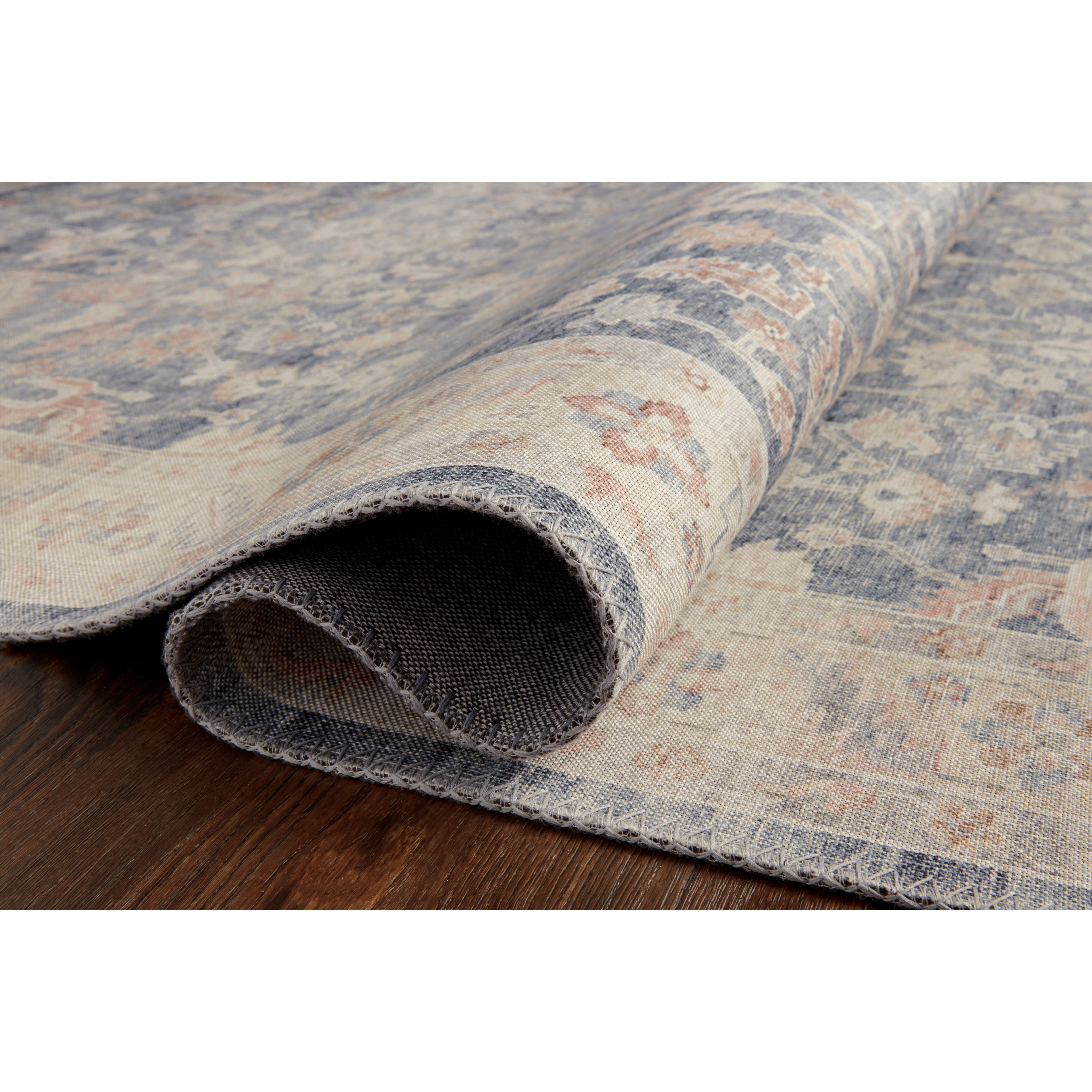 Featuring Hathaway Denim/Multi Rug by Loloi at Amethyst Home. Featuring soft motifs in a carefully curated color palate of blue, yellow, red, and hints of orange, the Hathaway Denim / Multi area rug captures the essence of one-of-a-kind vintage or antique area rug at an attractive price.
This rug is ideal for high traffic areas due to the rug's power-loomed.  Amethyst Home provides interior design, new home construction design consulting, vintage area rugs, and lighting in the Monterey metro area.