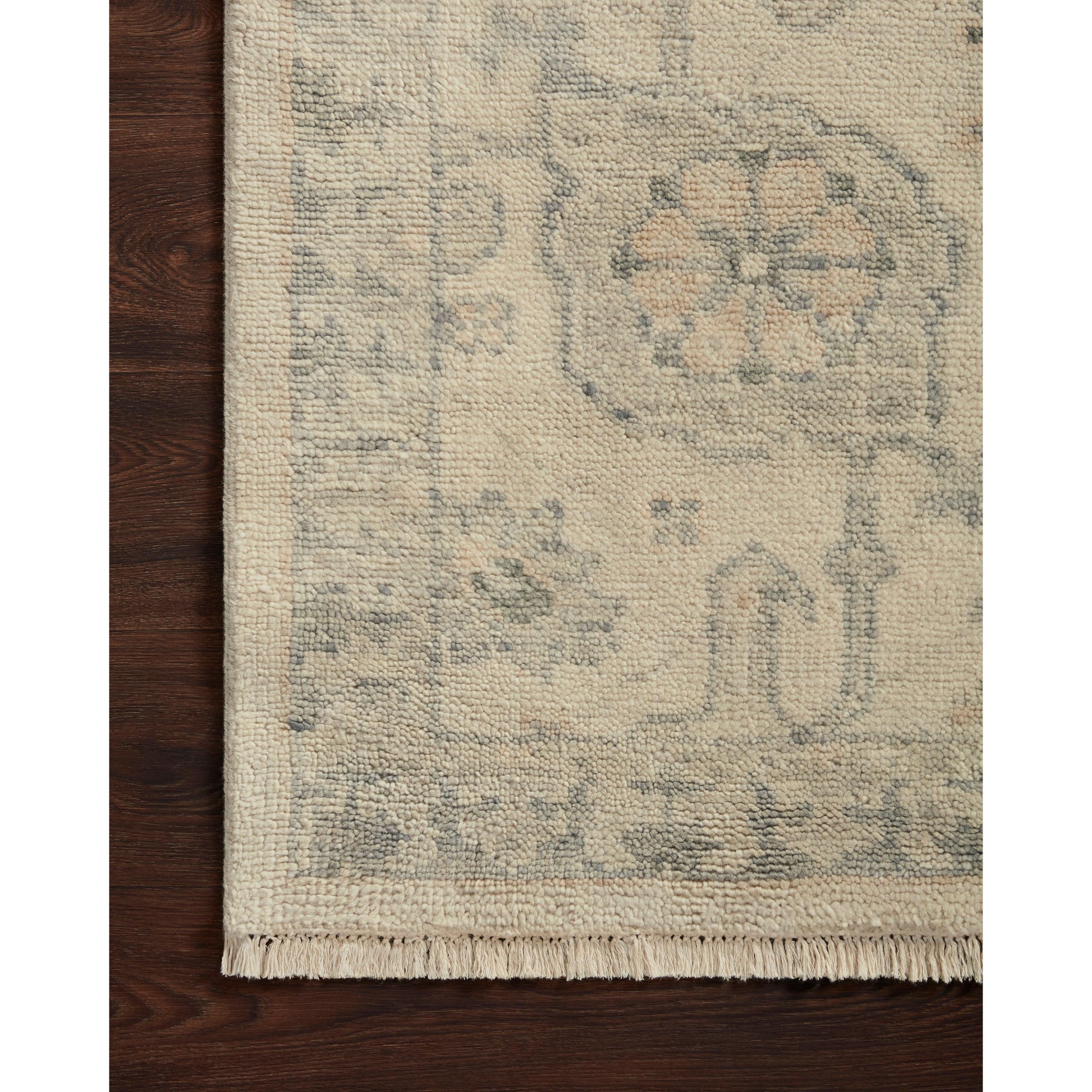The Helena Beige / Stone HEL-06 rug from Loloi is hand-knotted of 100% wool, refined, yet versatile for any home. The Helena rug combines weathered tones and worldly patterns for a beautiful grounding element in any room.
