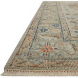 The Helena Stone / Multi HEL-09 area Rug from Loloi is hand-knotted of 100% wool, refined, yet versatile for any home. The Helena rug combines weathered tones and worldly patterns for a beautiful grounding element in any room.