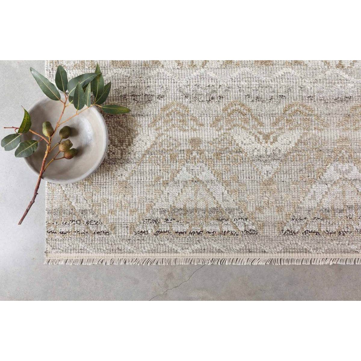 Featuring Idris Granite/Sand Hand-Knotted Rug by Loloi at Amethyst Home. The Idris Granite/Sand area rug from Loloi is meticulously hand-knotted of viscose and wool. You will love this rug because the rug is:

Perfect for entryways, living rooms, and bedrooms
Easy to clean and maintain
Gorgeous with the intricate pattern and patina
Warms up any room with t.  Amethyst Home provides interior design, new home construction design consulting, vintage area rugs, and lighting in the San Diego metro area.