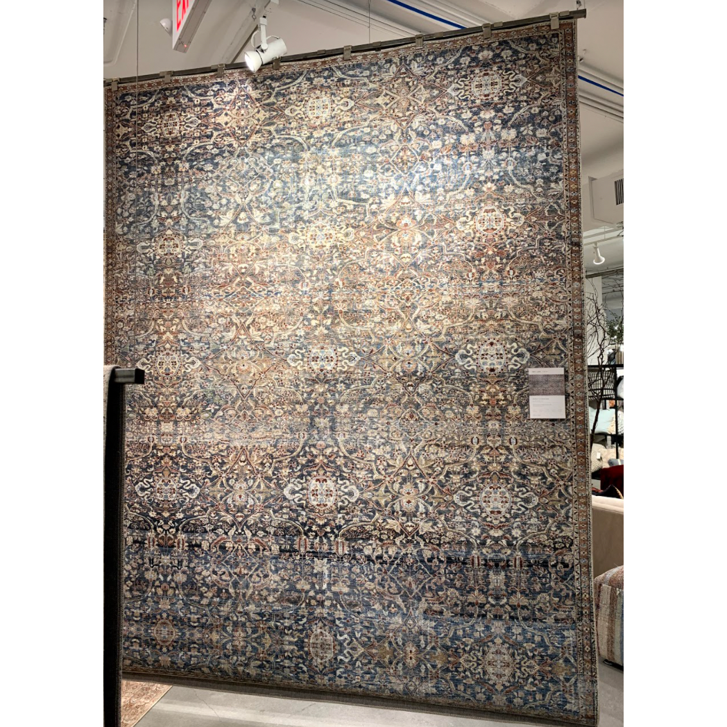 Durable, low pile, and soft underfoot, this rug is inspired by classic vintage and antique rugs. The Jules Chris Loves Julia Denim / Spice rug from Loloi features a beautiful vintage pattern and patina. The rug is easy to clean and maintain and perfect for living rooms, dining rooms, hallways, and kitchens!