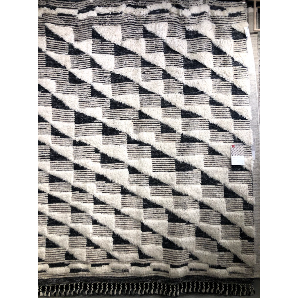 A nod to timeless Moroccan style, the Khalid Collection is hand-knotted in India by skilled artisans. The soft pile features 100% natural, undyed wool, lending slight variations in tones that make each piece it's own. Plus, each rug is finished with a thoughtfully designed fringe.  Hand Knotted 100% Wool KF-02 Natural/Black