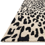 Hooked of 100% wool, this Masai Collection is a softer side of the savannah brought to life by artisans in India. Masai is a beautiful contemporary rug with contrasting hues and is a chic twist on the classic animal print.  Hooked 100% Wool MAS-02 Black / Ivory