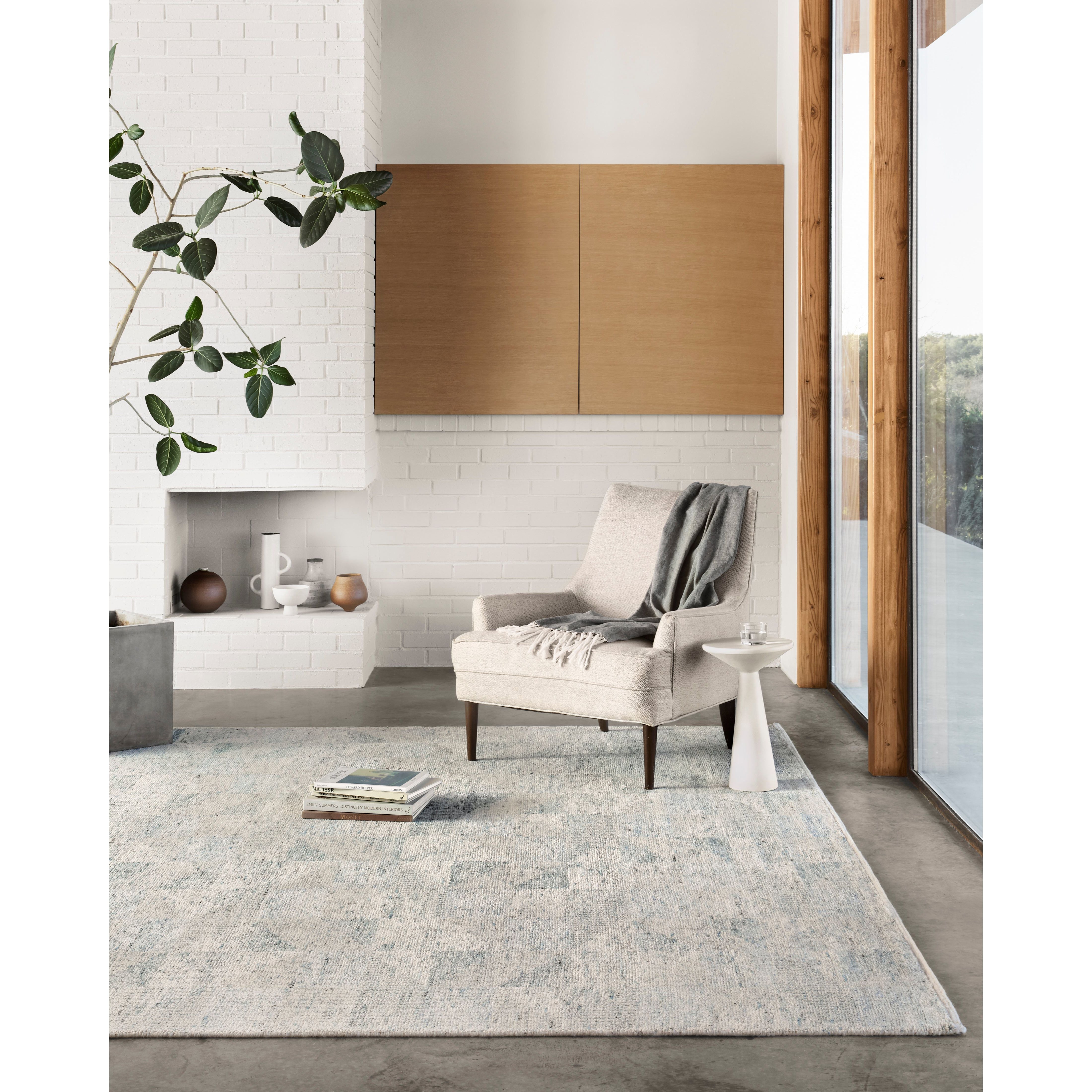 Drawing inspiration from tribal influences, the Odyssey Light BlueArea  Rug combines relaxed linear pattern with a sophisticated color palette. Each Odyssey area rug, which is hand knotted of wool, viscose, and cotton, is crafted entirely by hand by master artisans in India.  Hand Knotted 70% Viscose from Bamboo | 30% Wool OD-06 Light Blue