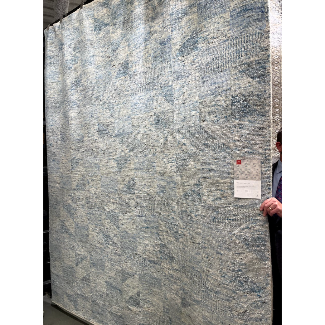 Drawing inspiration from tribal influences, the Odyssey Light BlueArea  Rug combines relaxed linear pattern with a sophisticated color palette. Each Odyssey area rug, which is hand knotted of wool, viscose, and cotton, is crafted entirely by hand by master artisans in India.  Hand Knotted 70% Viscose from Bamboo | 30% Wool OD-06 Light Blue