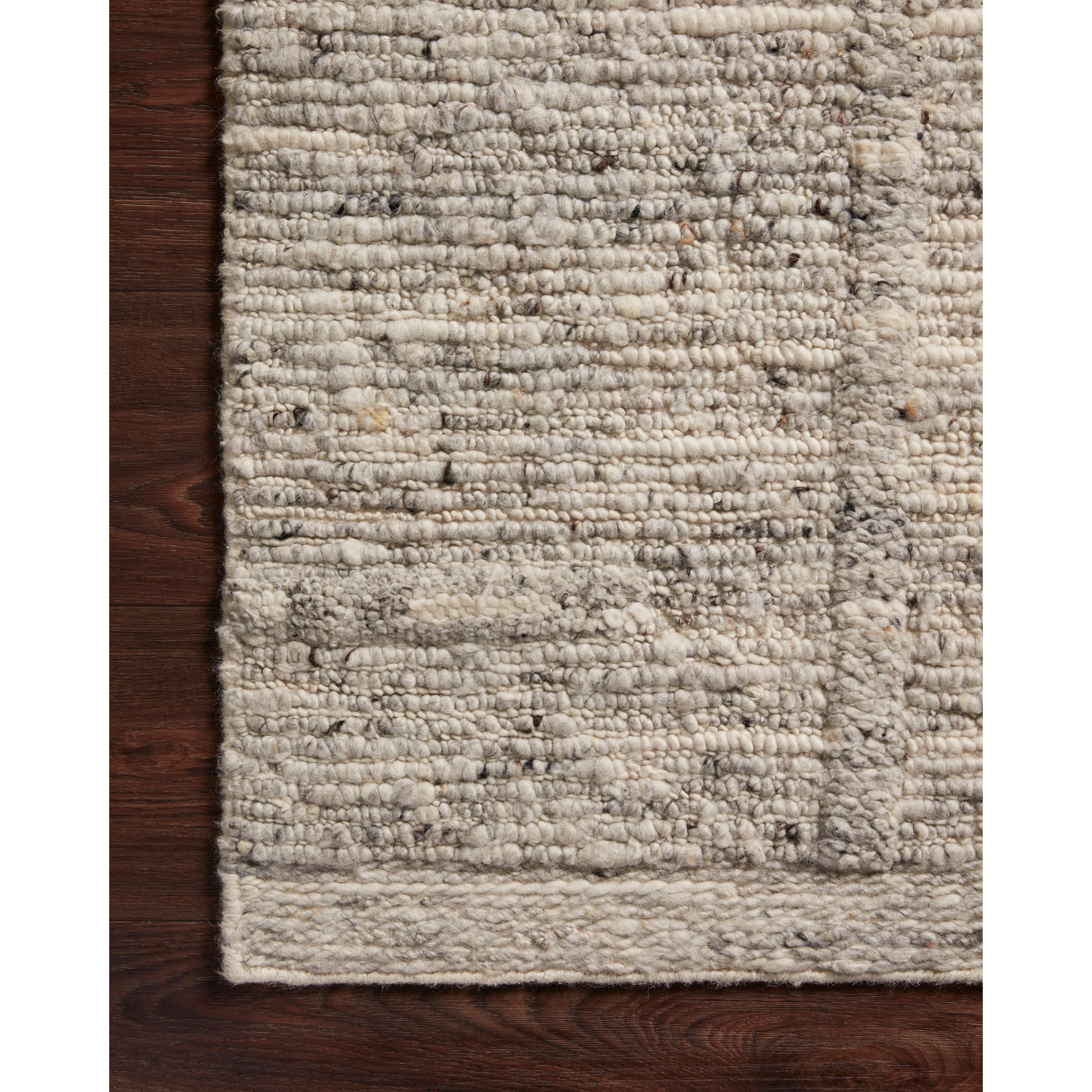 Featuring Rayan Silver Rug by Loloi at Amethyst Home. Hand-woven of 100% wool in India, the Rayan Silver Area Rug sets the tone for a calming atmosphere. Each design is crafted of textural highs and lows paired with neutral tones to create and engaging understatement. The perfect rug for your bedroom, office, or other medium traffic area. 
Hand Woven93% Wool .  Amethyst Home provides interior design, new home construction design consulting, vintage area rugs, and lighting in the Dallas metro area.
