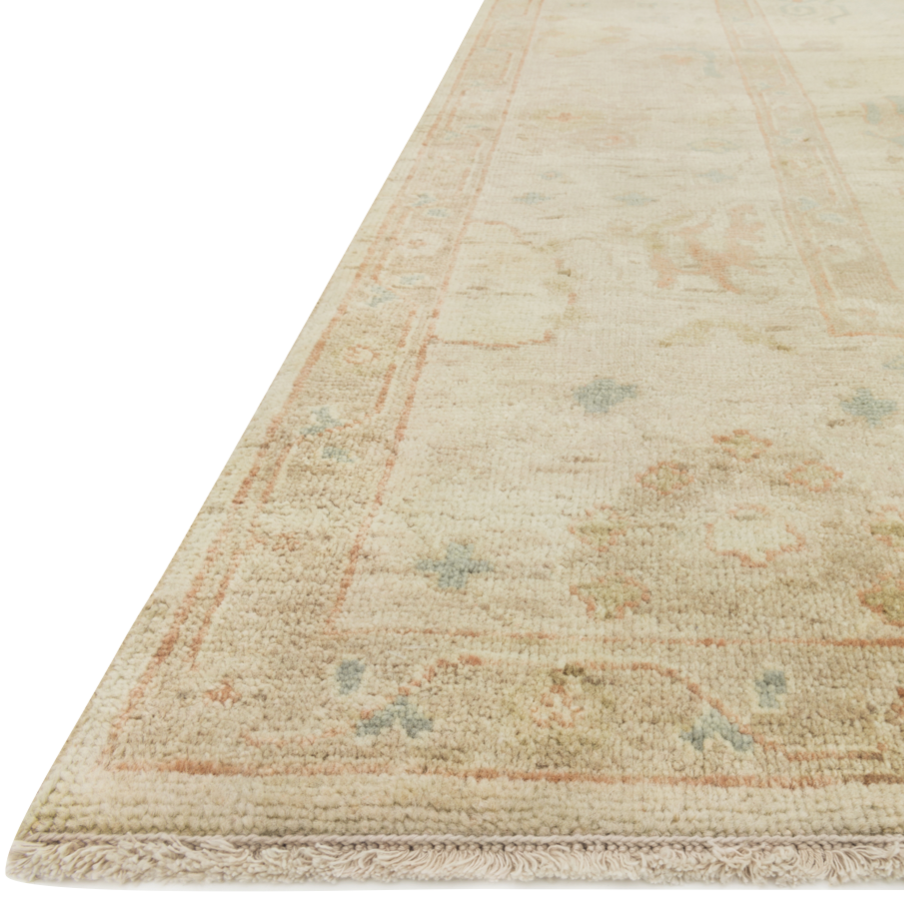 Hand knotted of 100% wool by skilled artisans, the Loloi Vincent Pebble / Pebble Area Rug, or VC-06, offers the look of a well-worn antique rug in a modern day color palette. Each exquisite piece undergoes a weeks-long antique washing process which fades the pattern and color beautifully. 