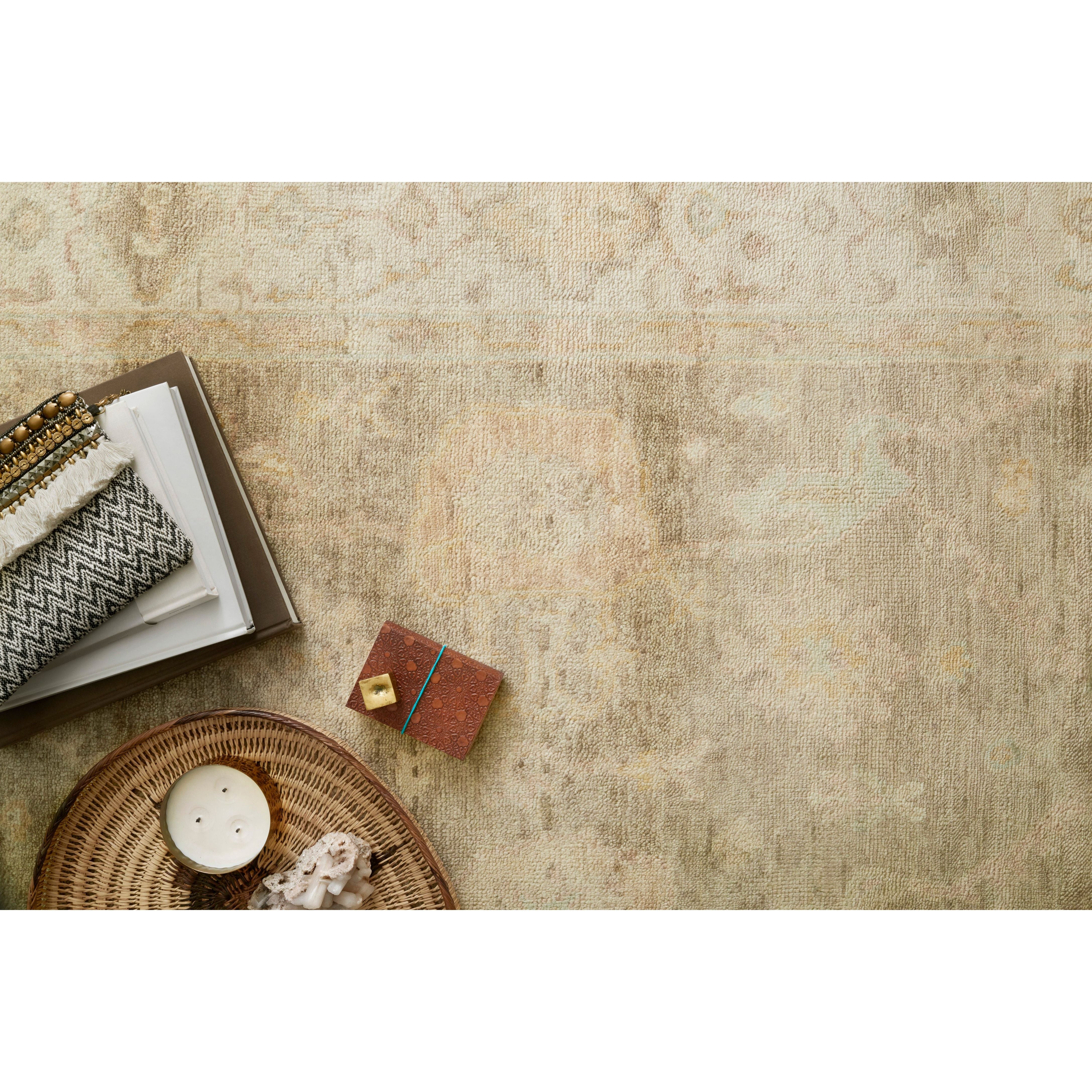 Hand knotted of 100% wool by skilled artisans, the Loloi Vincent Moss Gray /Stone Area Rug, or VC-02, offers the look of a well-worn antique rug in a modern day color palette. Each exquisite piece undergoes a weeks-long antique washing process which fades the pattern and color beautifully. 