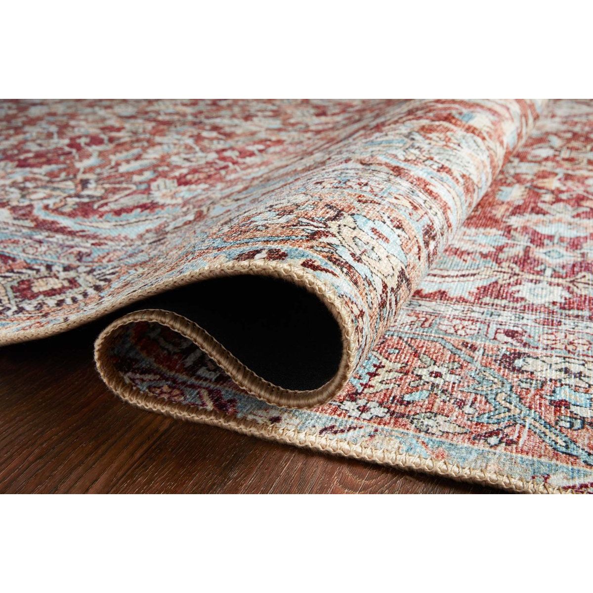 Featuring Wynter Tomato / Teal Rug by Loloi at Amethyst Home. Old soul, new spirit. Power-loomed of 100% polyester, the Wynter Tomato / Teal area rug showcases a one-of-a-kind vintage or antique area rug look at an affordable price. This rug brings in tones of red, blue, orange, and hints of ivory, and ideal for high traffic areas due to the rug's durability. .  Amethyst Home provides interior design, new home construction design consulting, vintage area rugs, and lighting in the Miami metro area.