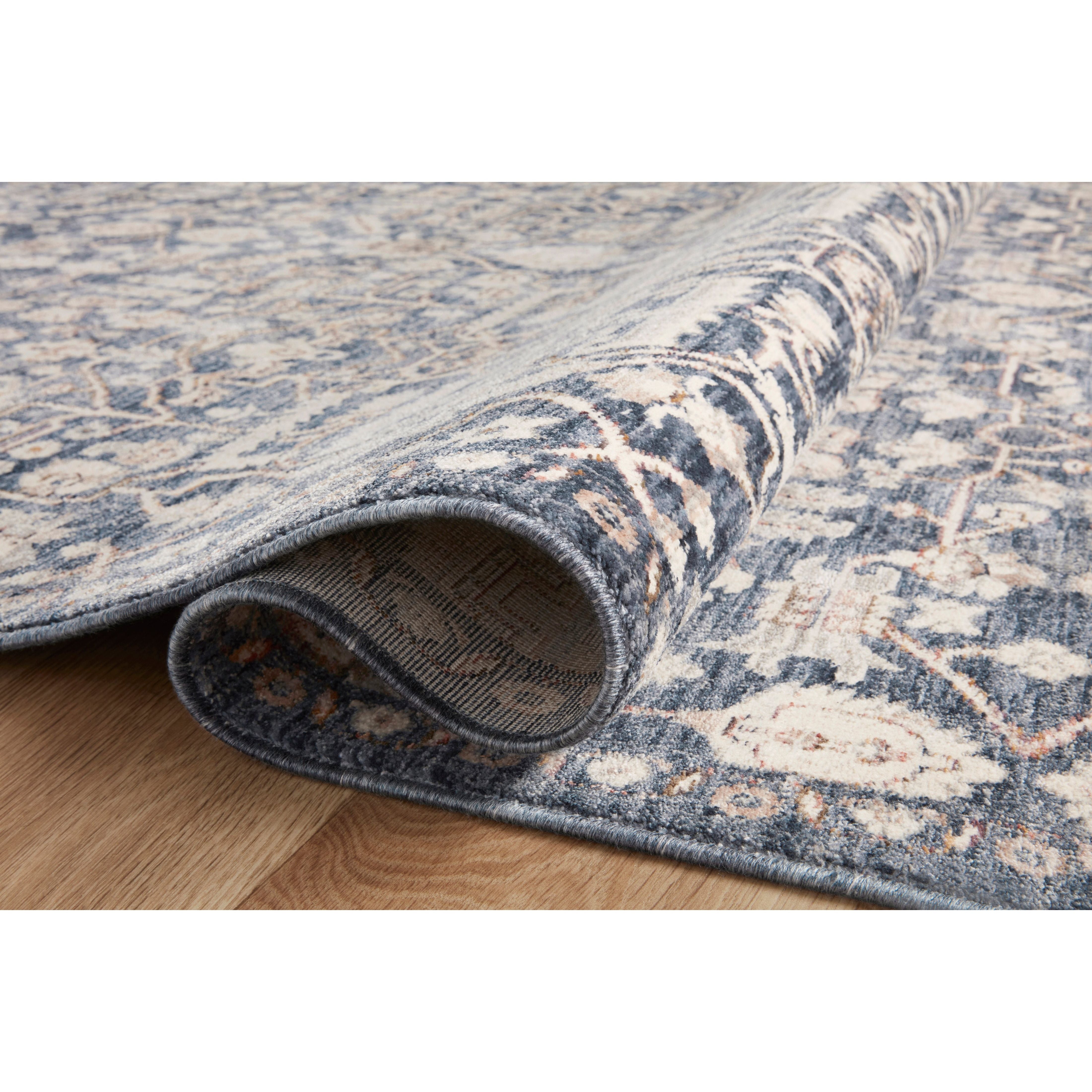 Stain-resistant, fade-resistant, and long-lasting, the Zuma Collection for Amber Lewis x Loloi features a soft pile in a serene grey, blue and ivory palette. Zuma also carries the Okeo-Tex® label, ensuring the rug's materials do not contain harmful substances. Power Loomed 100% Polyester Pile ZUM-02 AL Blue / Ivory