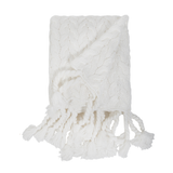 This Capistrano Throw - Three Colors is a soft cable knit throw featuring Pom Pom at Home's popular long twisted tassels along the edge. Available in 3 gentle colors.   Size: 50" x 70" Material: 100% Acrylic