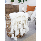 This Capistrano Throw - Three Colors is a soft cable knit throw featuring Pom Pom at Home's popular long twisted tassels along the edge. Available in 3 gentle colors.   Size: 50" x 70" Material: 100% Acrylic