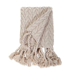 This Capistrano Throw - Three Colors is a soft cable knit throw featuring Pom Pom at Home's popular long twisted tassels along the edge. Available in 3 gentle colors.   Size: 50" x 70" Material: 100% Acrylic
