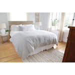 Subtle frayed edges of soft linen add a dash of unexpected detail to this Logan Duvet Collection Navy by Pom Pom at Home. Woven with two different colored yarns for a heathered effect, the duvet cover and shams feature shell button closures.  Inserts sold separately 100% linen Shell-button closure Machine wash cold; tumble dry low; warm iron as needed. Do not bleach