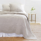 The Marseille Coverlet Bedding Taupe by Pom Pom at Home is luxurious and elegant with a detailed floral and diamond quilted pattern on the front made of 100% stone washed cotton velvet.  100% cotton velvet Machine wash cold; tumble dry low; warm iron as needed Do not bleach 
