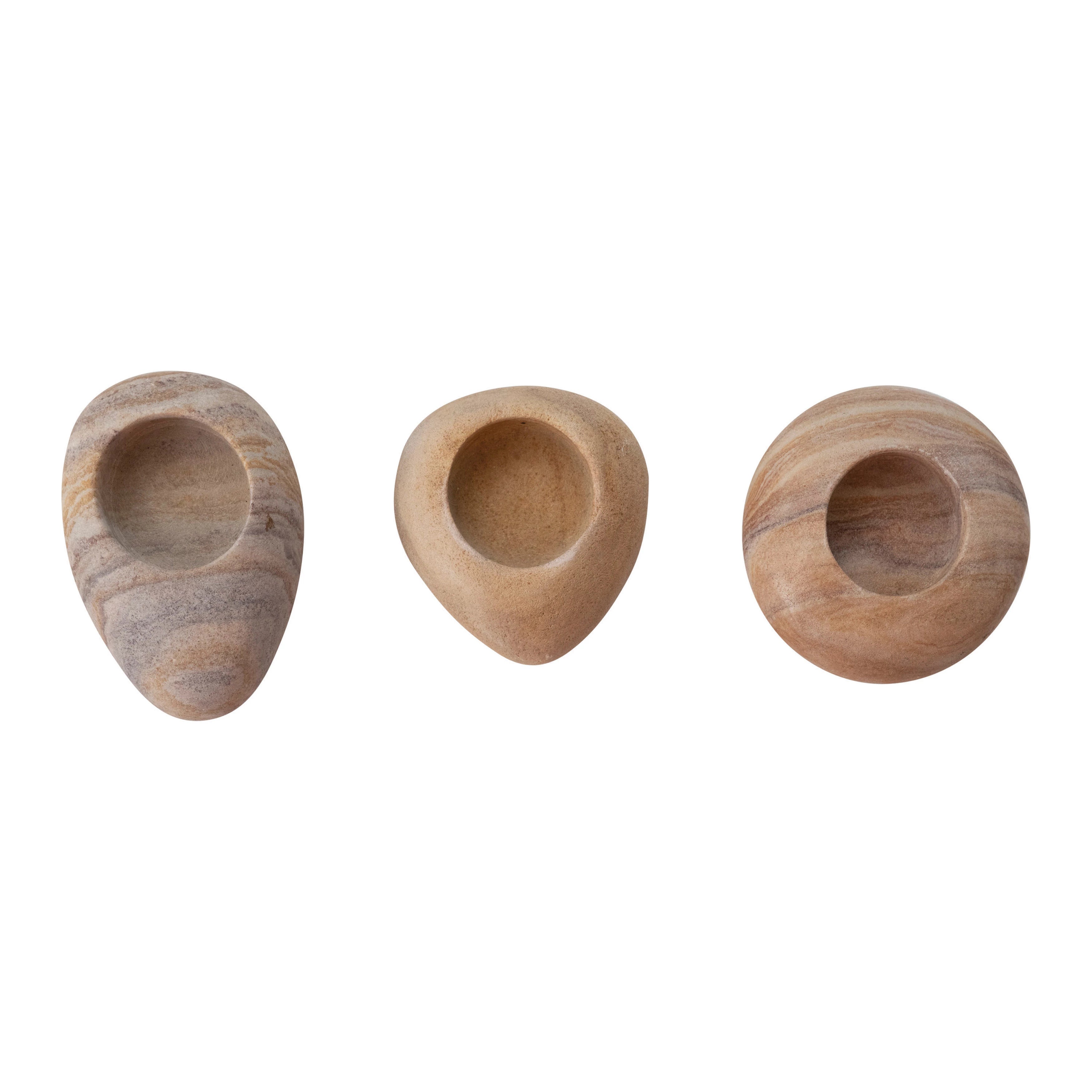 These Sandstone Tealight Holders add an organic ambiance -- the natural aspect of these sandstone tea lights make it a whole vibe. Pair together or one on its own.   Each one will vary.   Size: 4"L x 2.75 "W x 3.5" Round 
