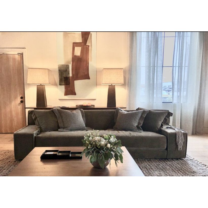 The ultimate low, cozy sofa. We would put this Esme Sofa Family from Verellen in the family room, living room or movie theater. The juxtaposition of a juicy, miniature-spring filled down-wrapped cushion and firm back is ultra-comfortable. Amethyst Home provides interior design, new home construction design consulting, vintage area rugs, and lighting in the Seattle metro area.