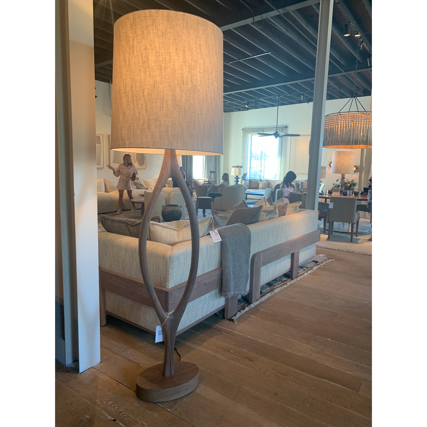 The Urbino Walnut Lamp is crafted from sustainably harvested hardwood by Verellen in North Carolina. The unique shape of the body paired with the oatmeal shade complements any room   Base: 16"w x 8"d x 62"h Overall Height: 76"h